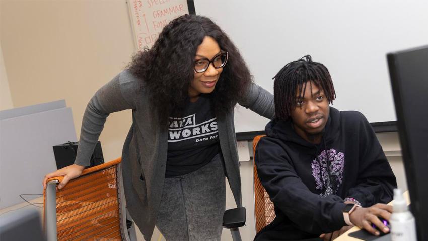 A DataWorks instructor with a program member.