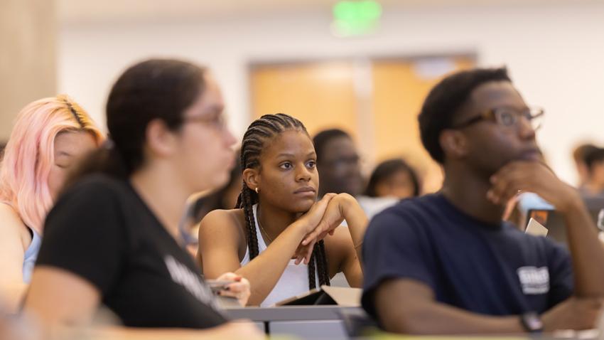 Students in a classroom listening.